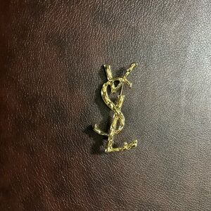 NEW Gold Tone Logo Brooch.  Has a pin on the back.